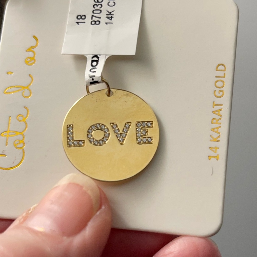 14Kt. gold disk charm,  nice size, the word “Love” is on the front!